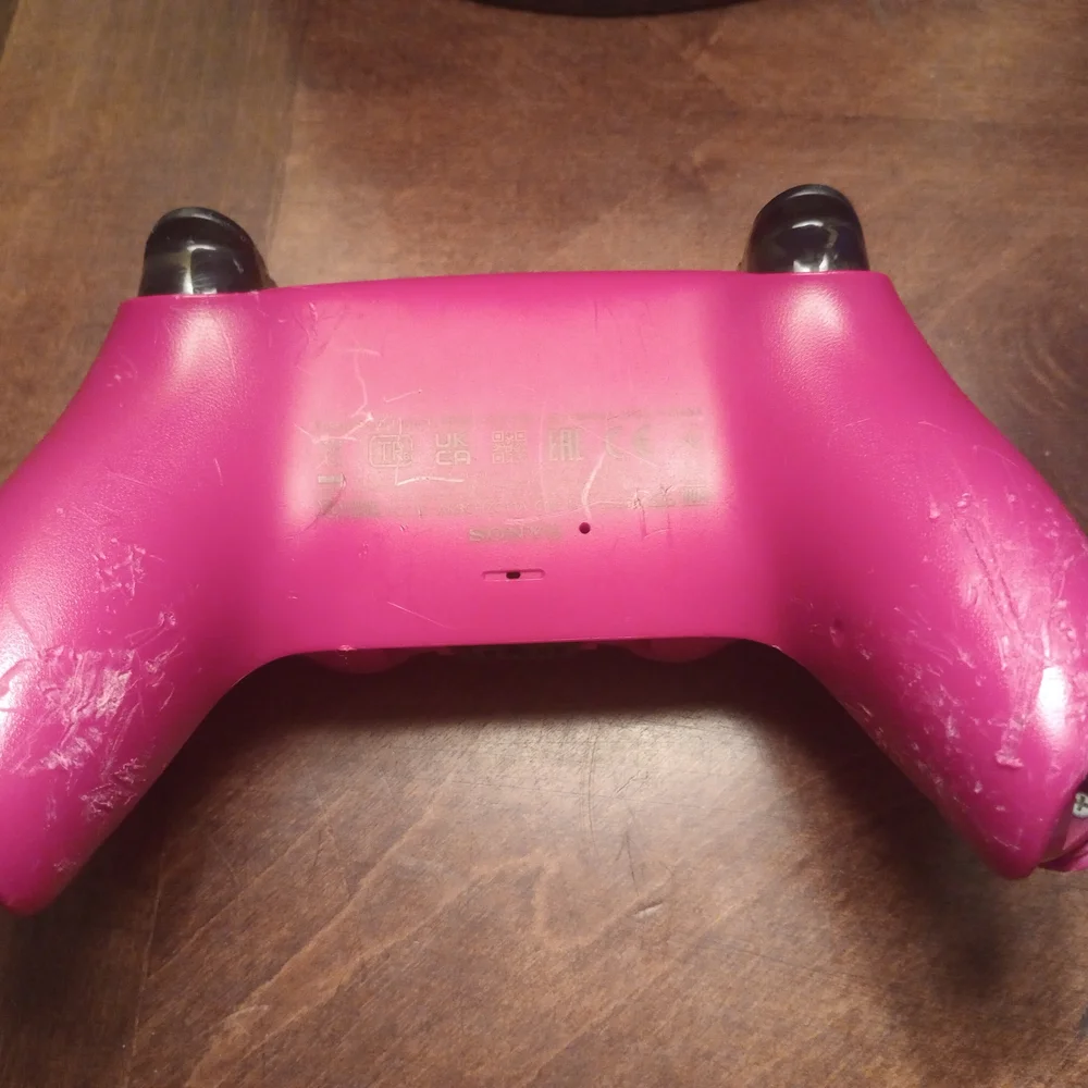 Gray and Pink Video Game Controllers